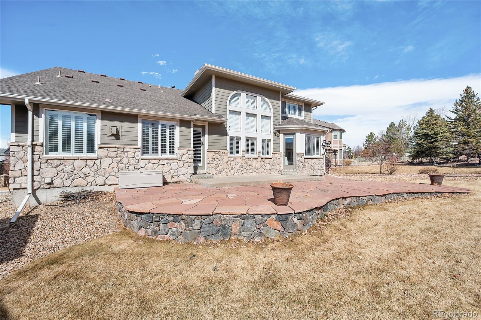 22426 East Roxbury Place Aurora, CO 80016 - Photo 46 of 50 a front view of a house with a yard