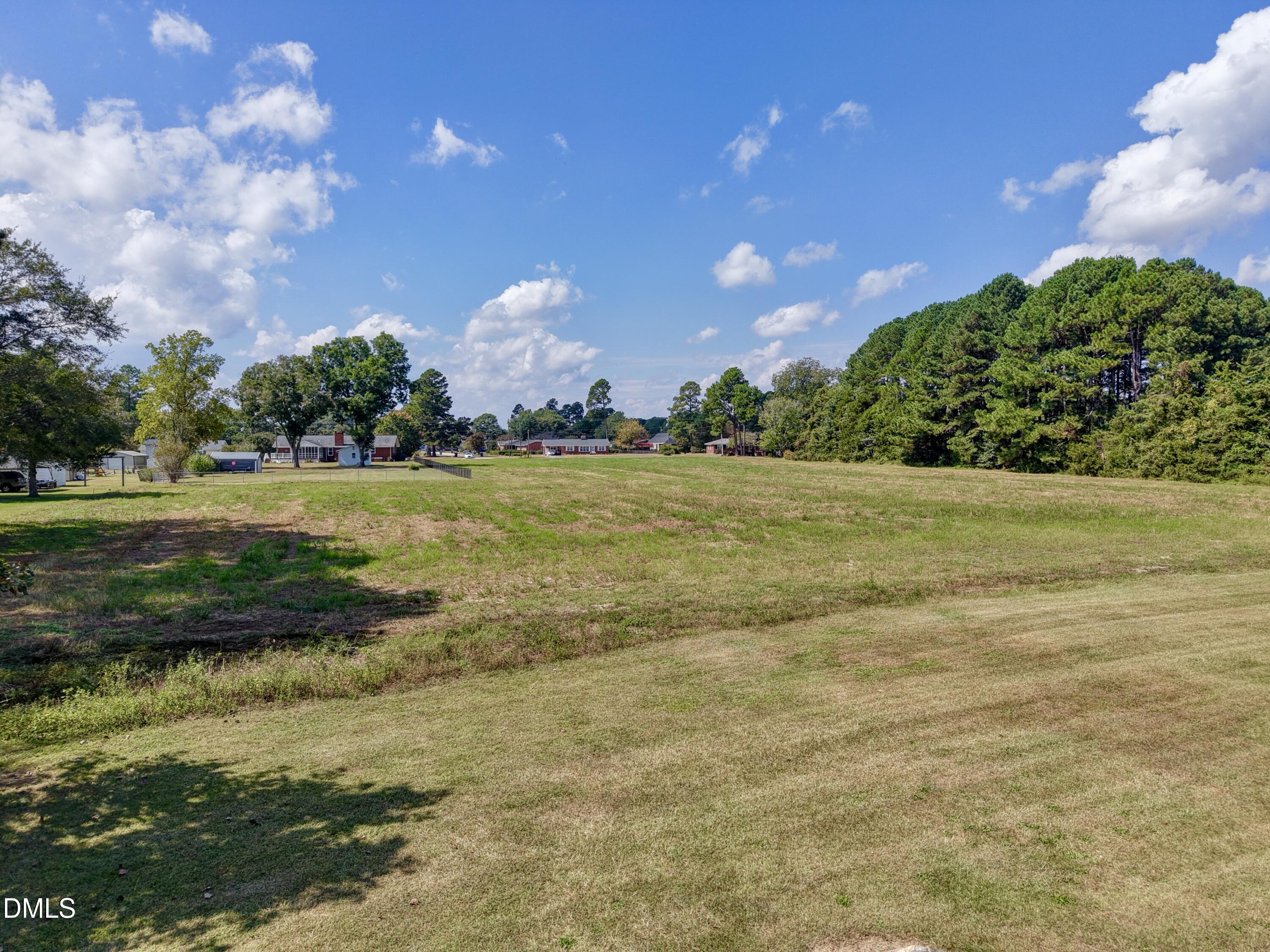 4.47-ac Fairground Road Dunn, NC 28334 - Photo 14 of 23 a view of yard with swimming pool and green space