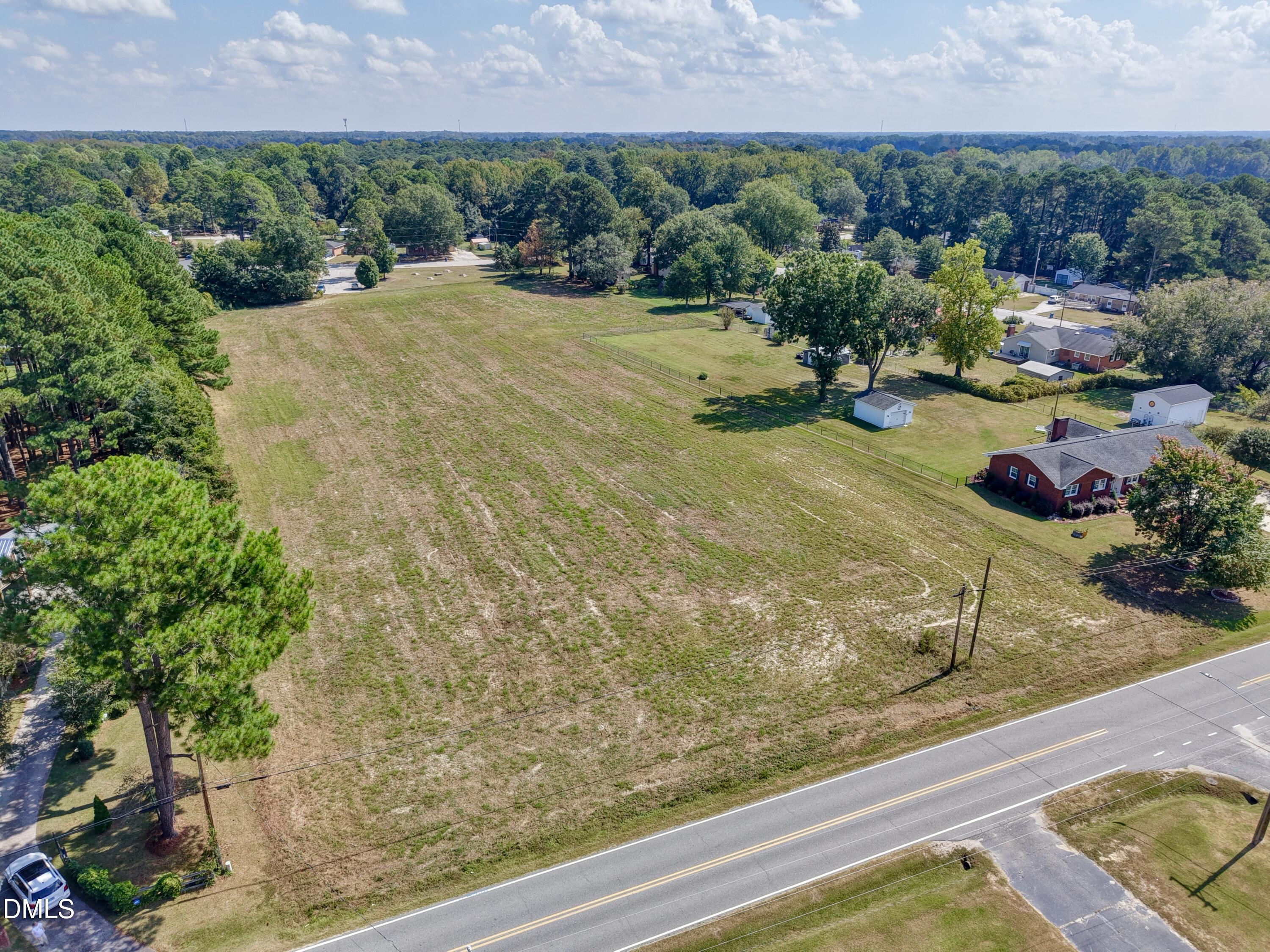 4.47-ac Fairground Road Dunn, NC 28334 - Photo 5 of 23 a view of a garden with a bench
