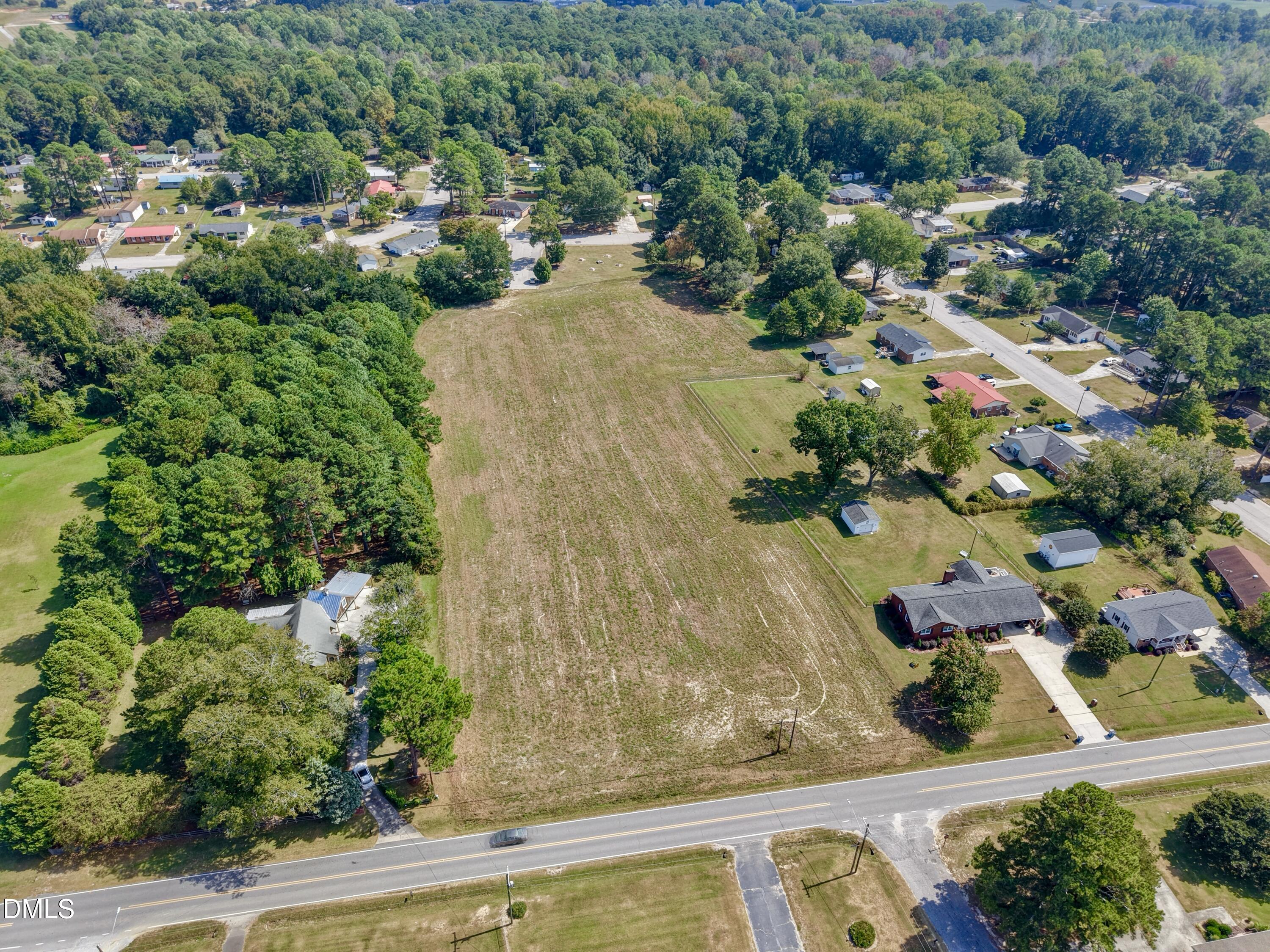 4.47-ac Fairground Road Dunn, NC 28334 - Photo 10 of 23 an aerial view of residential house with outdoor space and trees all around