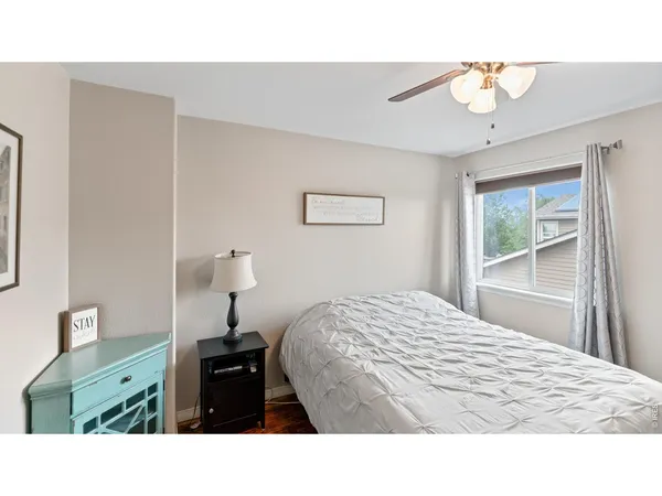a bed room with a bed and a book shelf