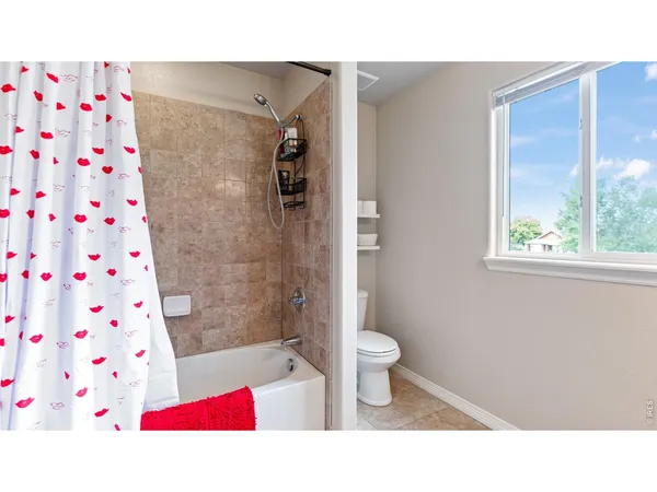 a kitchen with a sink cabinets and window