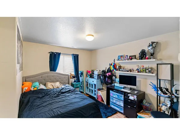a bathroom with a granite countertop sink toilet a large mirror and shower