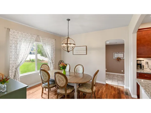 a dining room with furniture and window