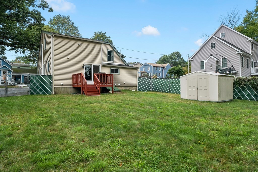 102 Orange Street Reading, MA 01867 - Photo 22 of 23 a view of a house with backyard and porch