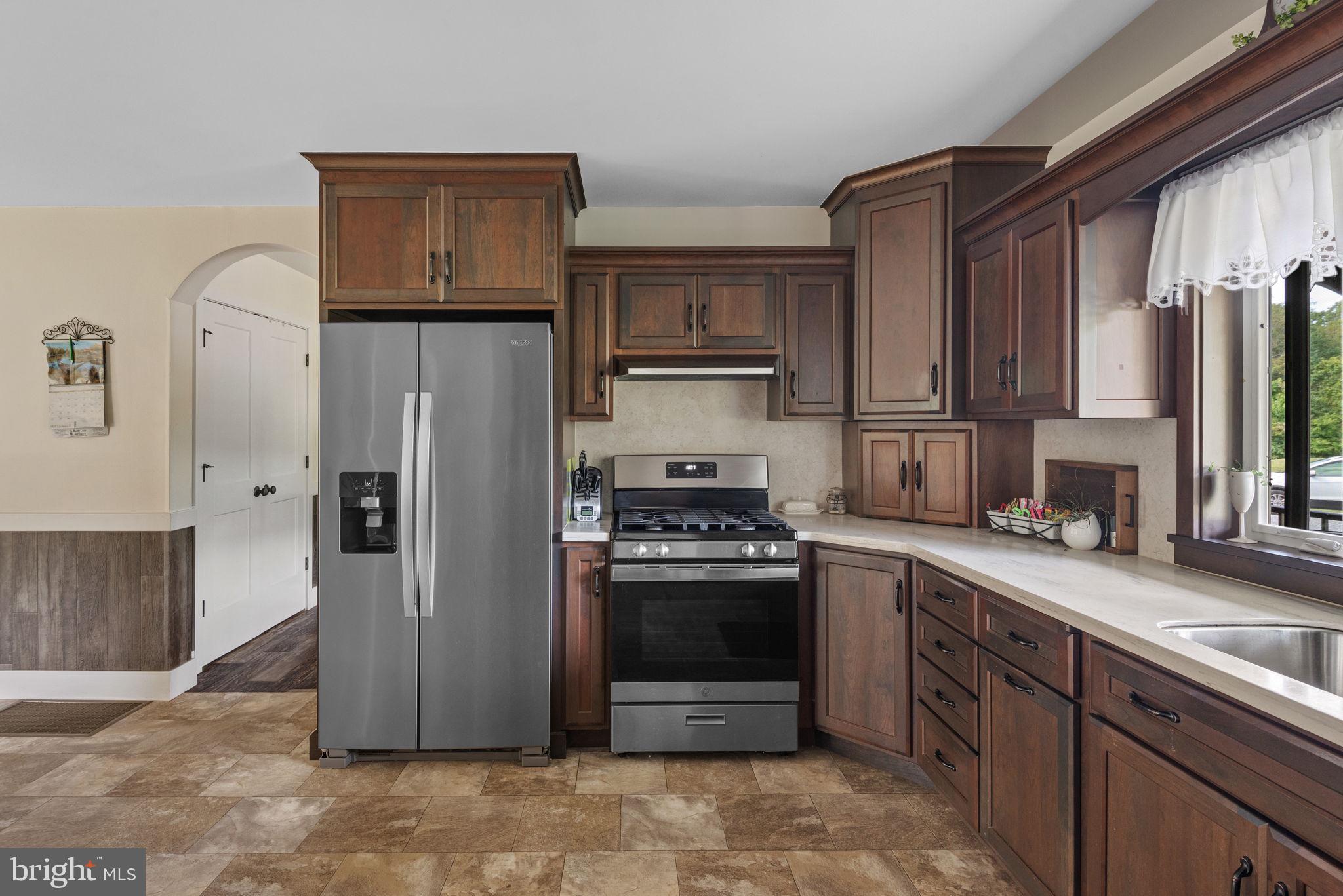 5382 Paes Road New Holland, PA 17557 - Photo 15 of 80 a kitchen with stainless steel appliances granite countertop a refrigerator stove and sink
