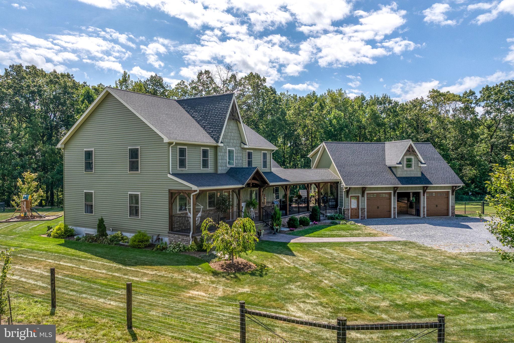 5382 Paes Road New Holland, PA 17557 - Photo 2 of 80 a front view of a house with garden