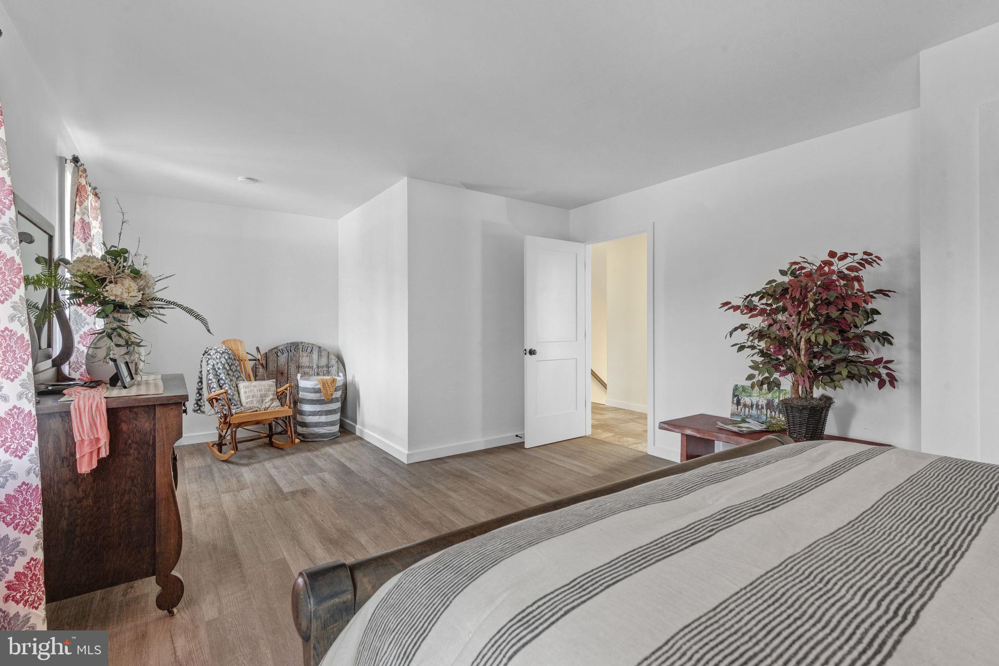 5382 Paes Road New Holland, PA 17557 - Photo 30 of 80 a bedroom with a bed and potted plants
