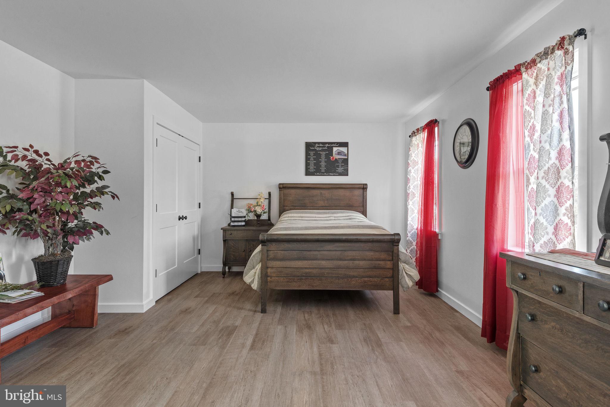 5382 Paes Road New Holland, PA 17557 - Photo 31 of 80 a bedroom with furniture and a wooden floor