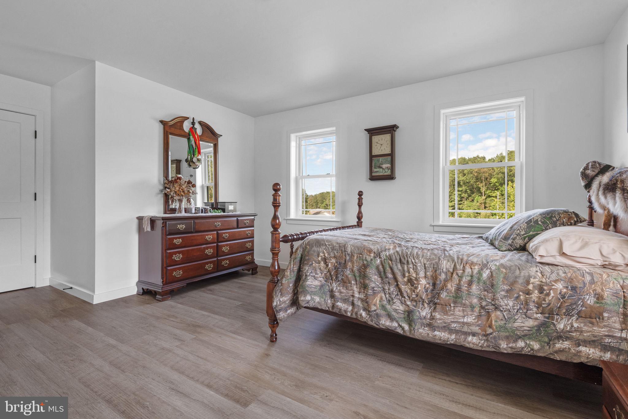 5382 Paes Road New Holland, PA 17557 - Photo 33 of 80 a bedroom with a bed and a dresser