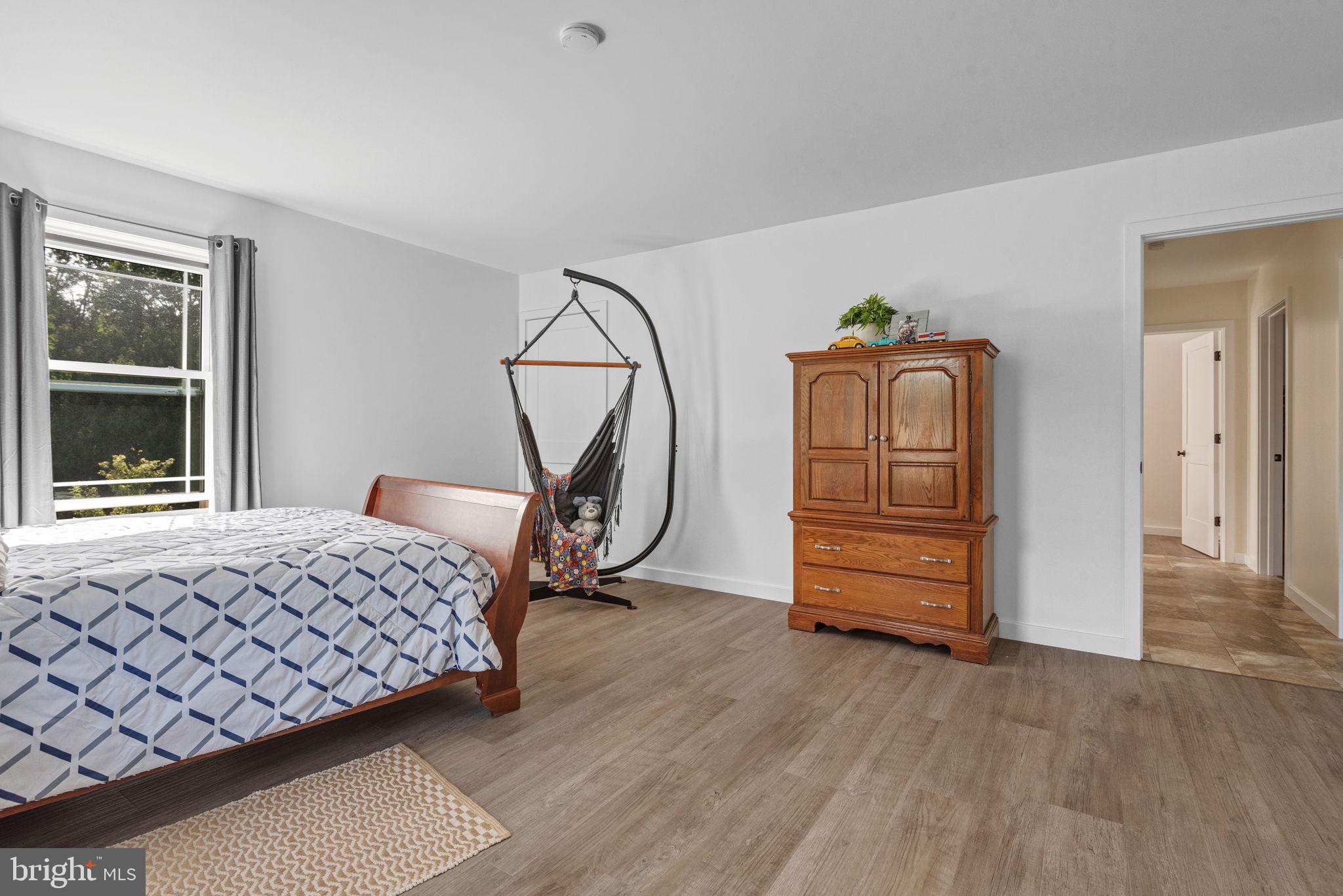 5382 Paes Road New Holland, PA 17557 - Photo 35 of 80 a bedroom with a bed and wooden floor
