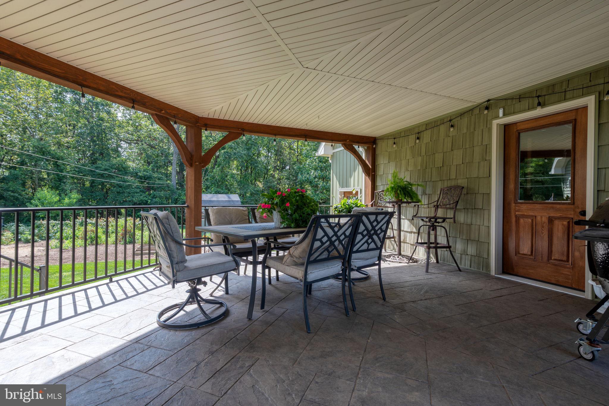 5382 Paes Road New Holland, PA 17557 - Photo 45 of 80 a view of a porch with chairs and backyard