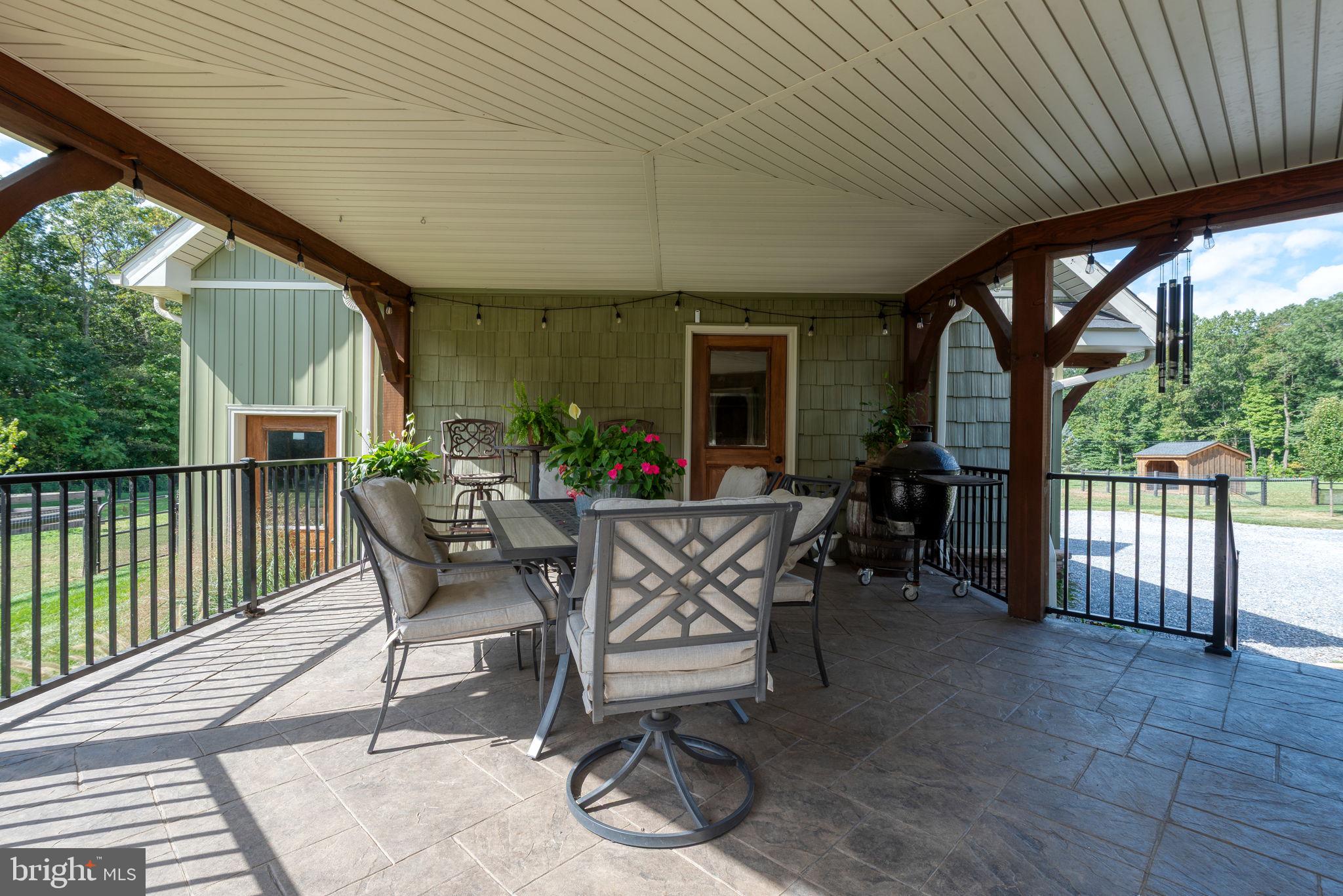 5382 Paes Road New Holland, PA 17557 - Photo 46 of 80 a view of a patio with table and chairs and potted plants