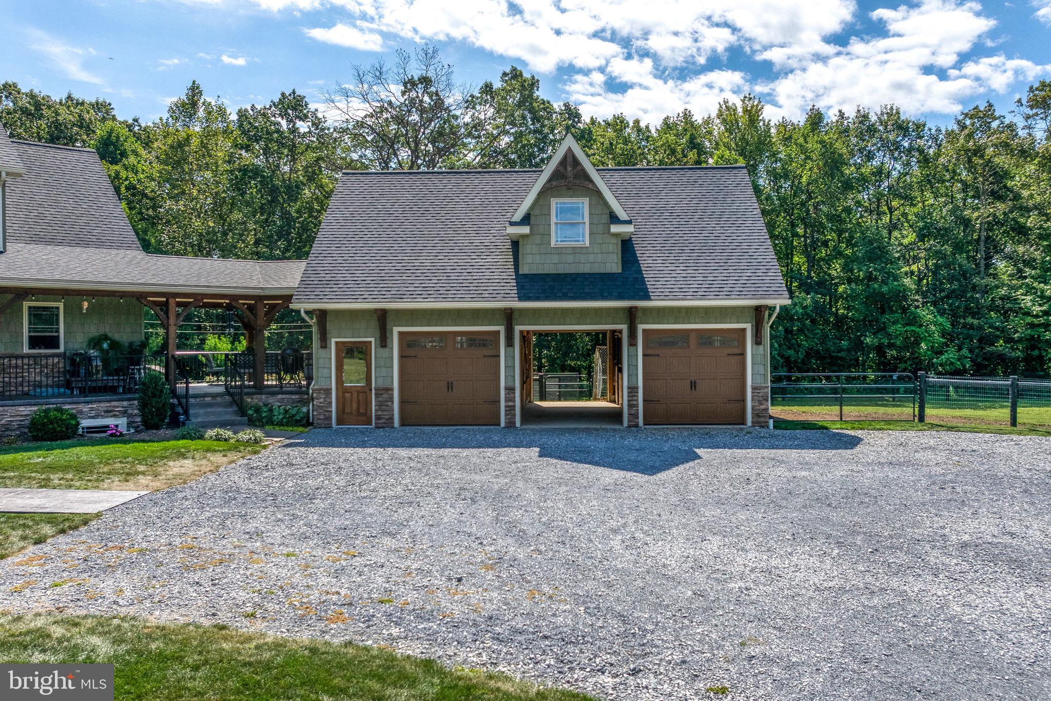 5382 Paes Road New Holland, PA 17557 - Photo 48 of 80 a front view of a house with a yard and porch