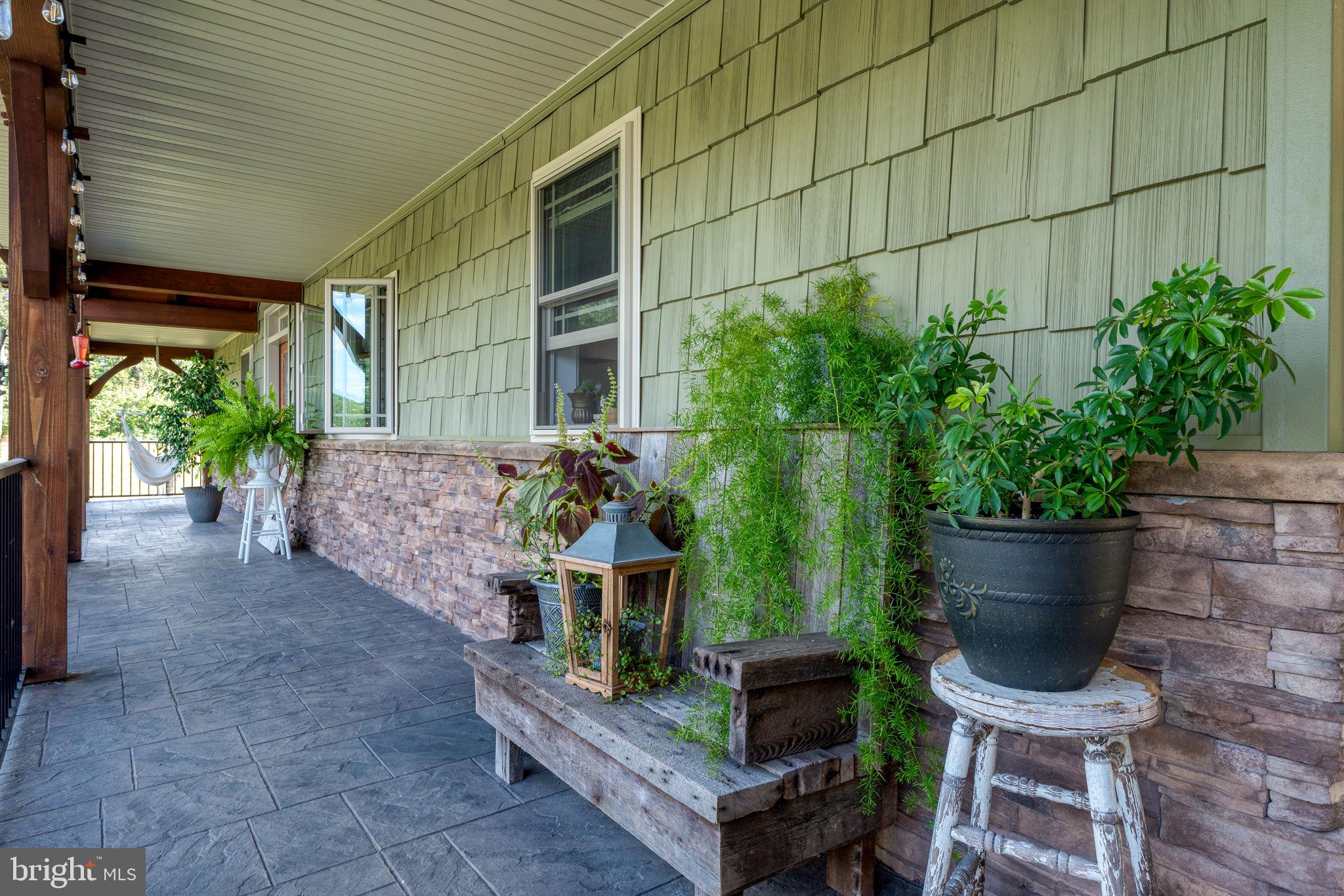 5382 Paes Road New Holland, PA 17557 - Photo 6 of 80 a wooden bench sitting in front of a building