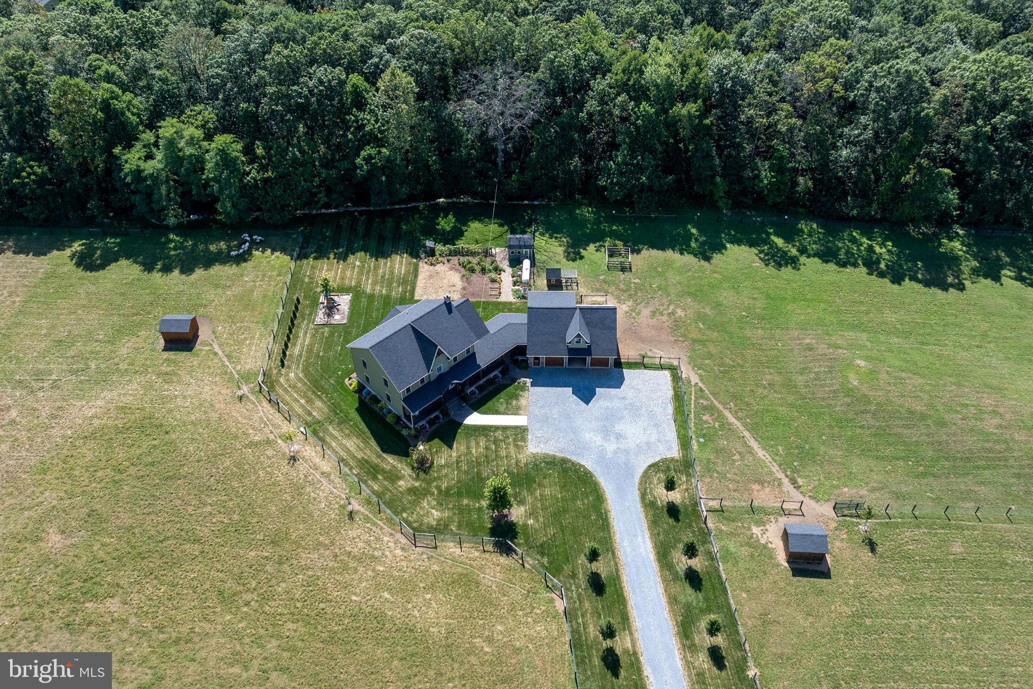 5382 Paes Road New Holland, PA 17557 - Photo 66 of 80 an aerial view of a house with swimming pool and garden