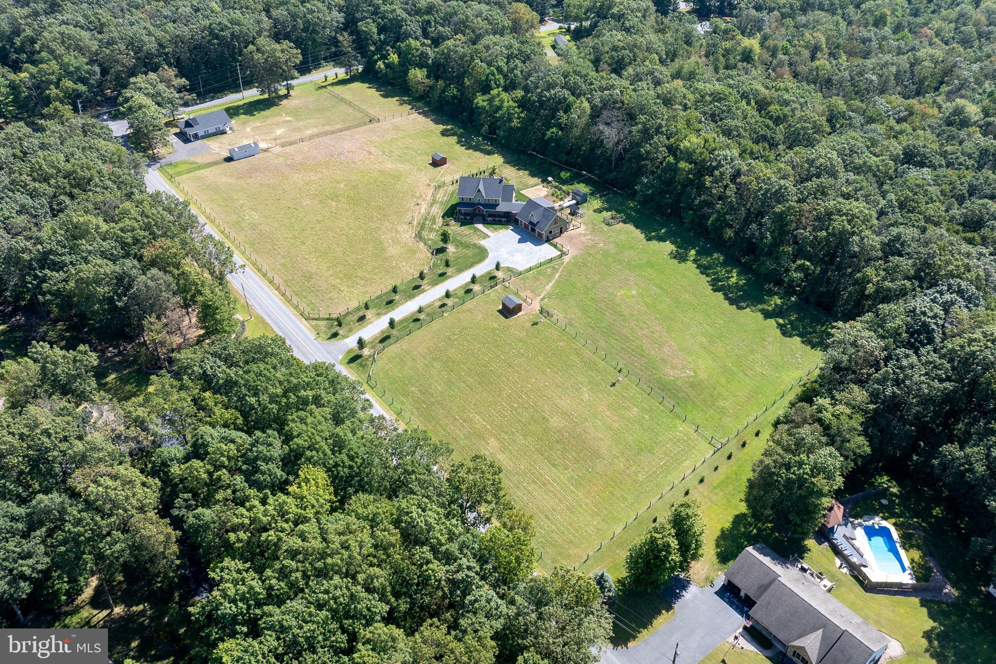 5382 Paes Road New Holland, PA 17557 - Photo 76 of 80 an aerial view of a house with a yard and trees