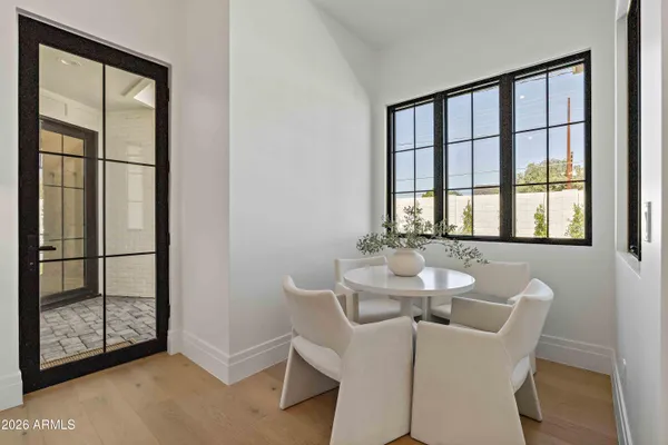 a dining room with furniture and window