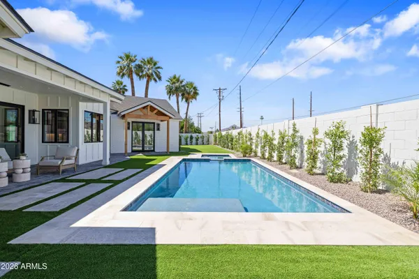 a view of yard with swimming pool