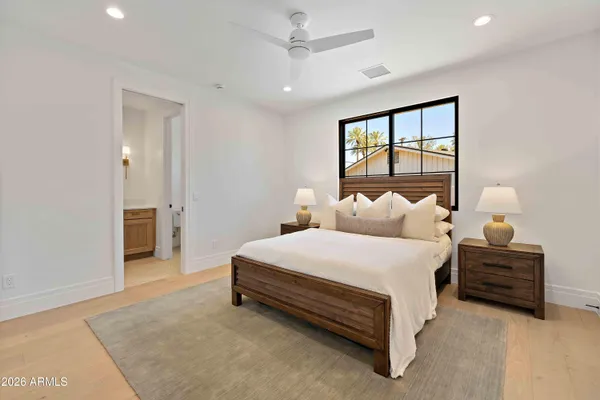 a bed room with bed and window