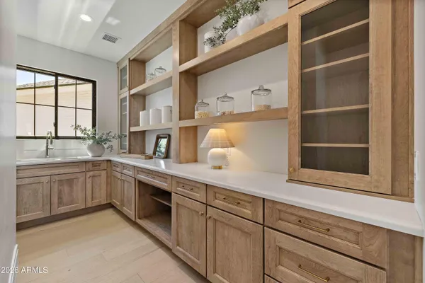 a kitchen with cabinets and window
