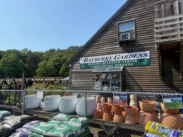 a view of backyard of house with seating space