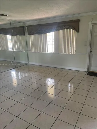 a view of an empty room and window