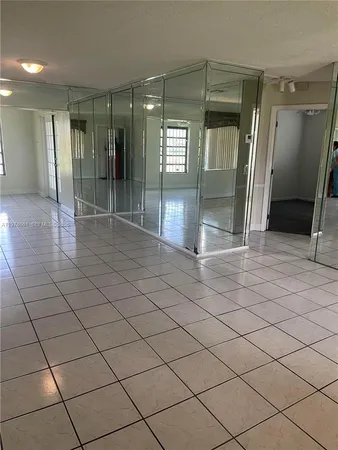 a bathroom with a glass door shower