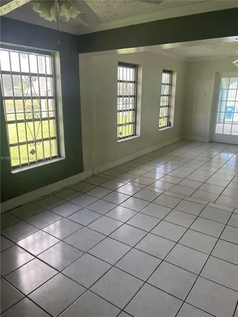 a view of an empty room and window