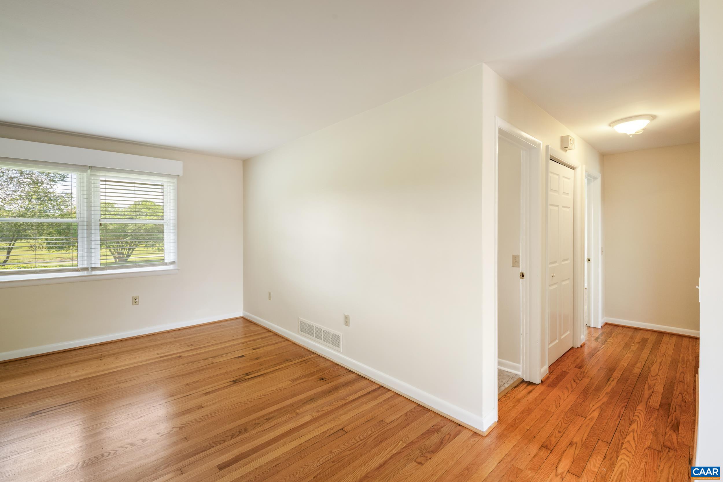 1293 Reas Ford Road Earlysville, VA 22936 - Photo 13 of 38 an empty room with wooden floor and windows
