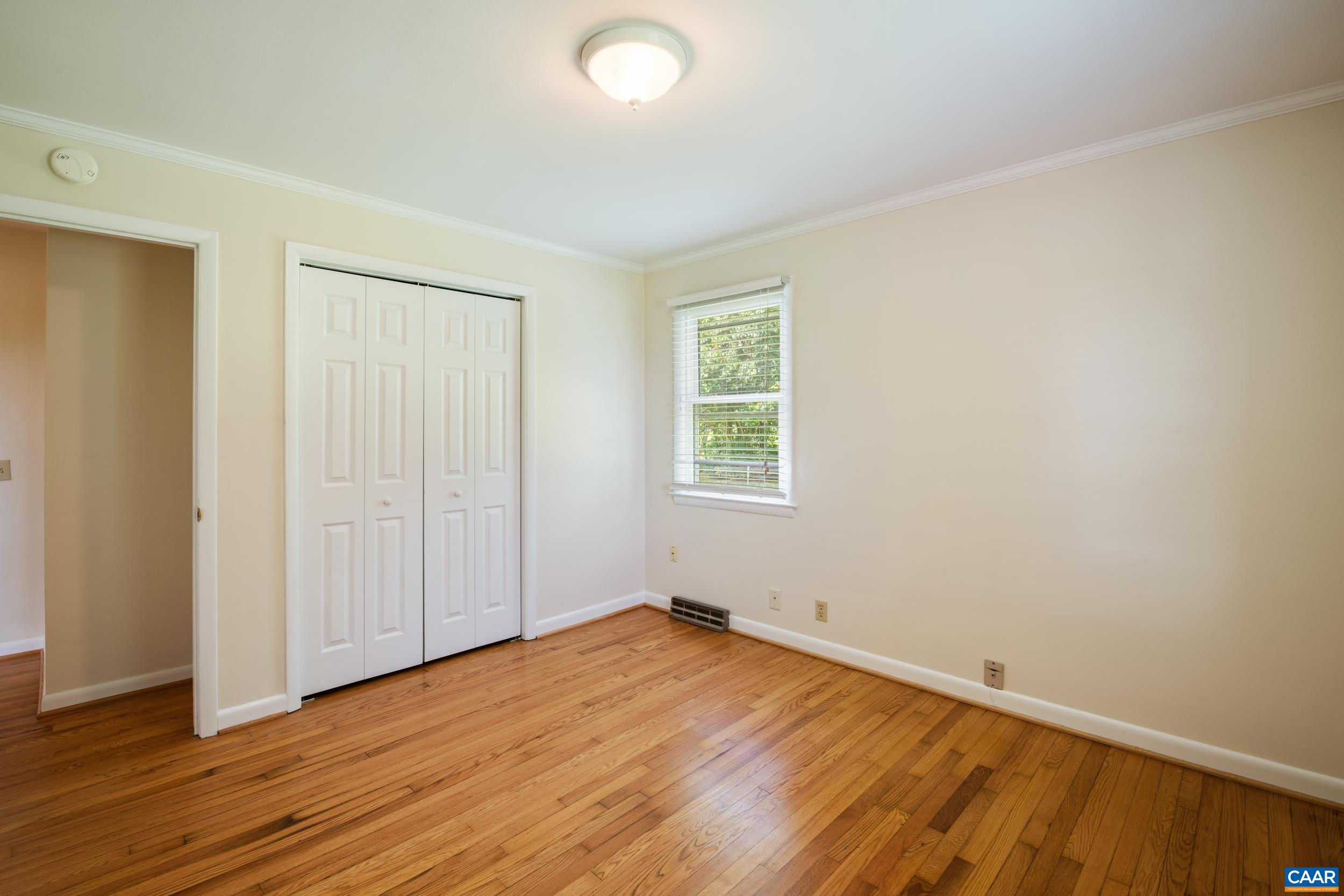 1293 Reas Ford Road Earlysville, VA 22936 - Photo 24 of 38 an empty room with wooden floor and windows