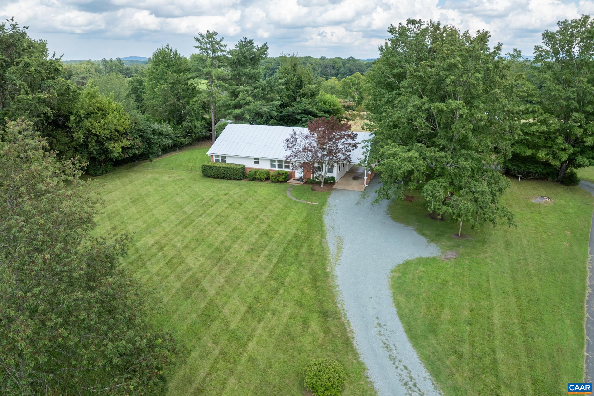 1293 Reas Ford Road Earlysville, VA 22936 - Photo 4 of 38 a view of a water pond with green yard