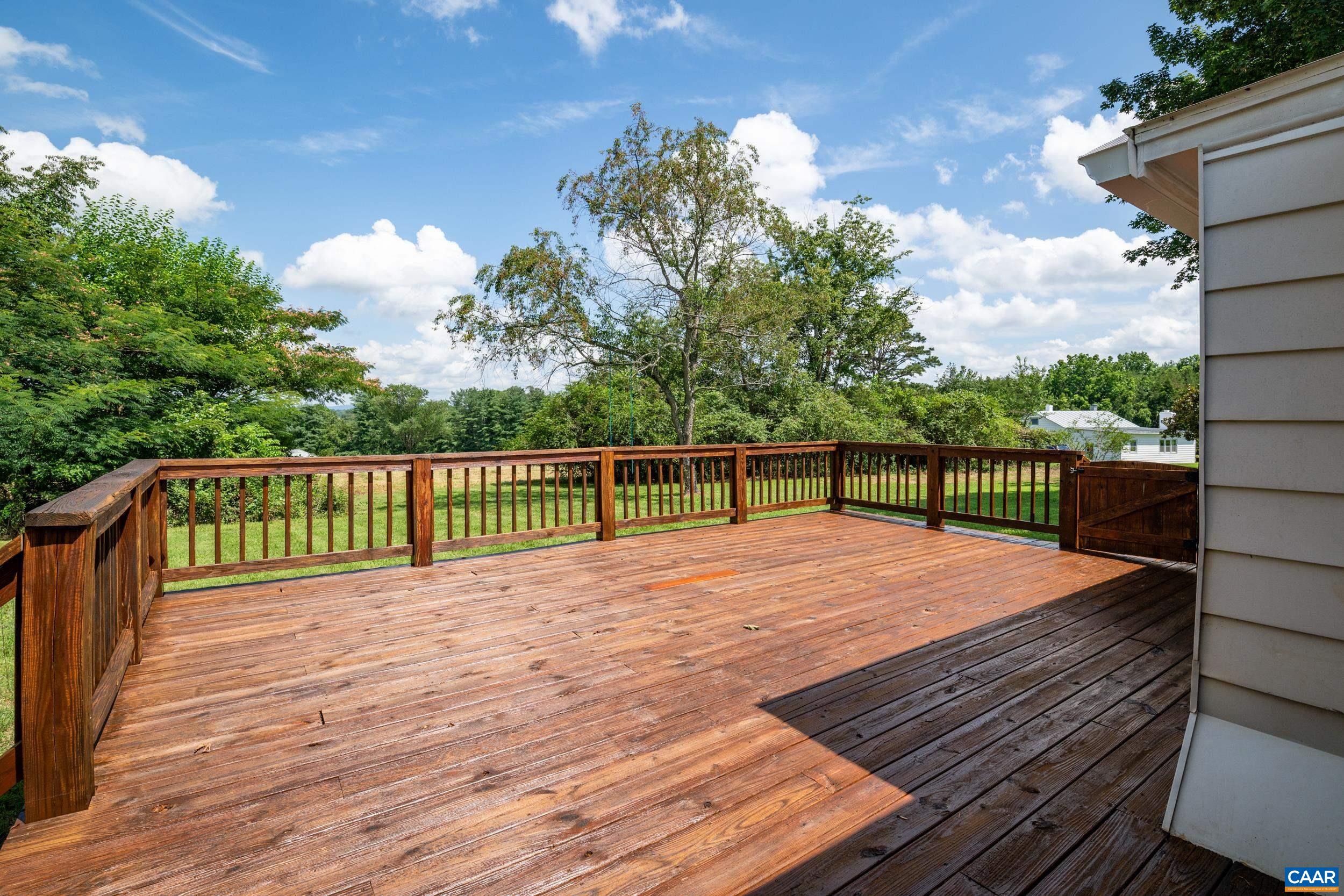 1293 Reas Ford Road Earlysville, VA 22936 - Photo 5 of 38 a view of deck with wooden floor and fence and a floor to ceiling window