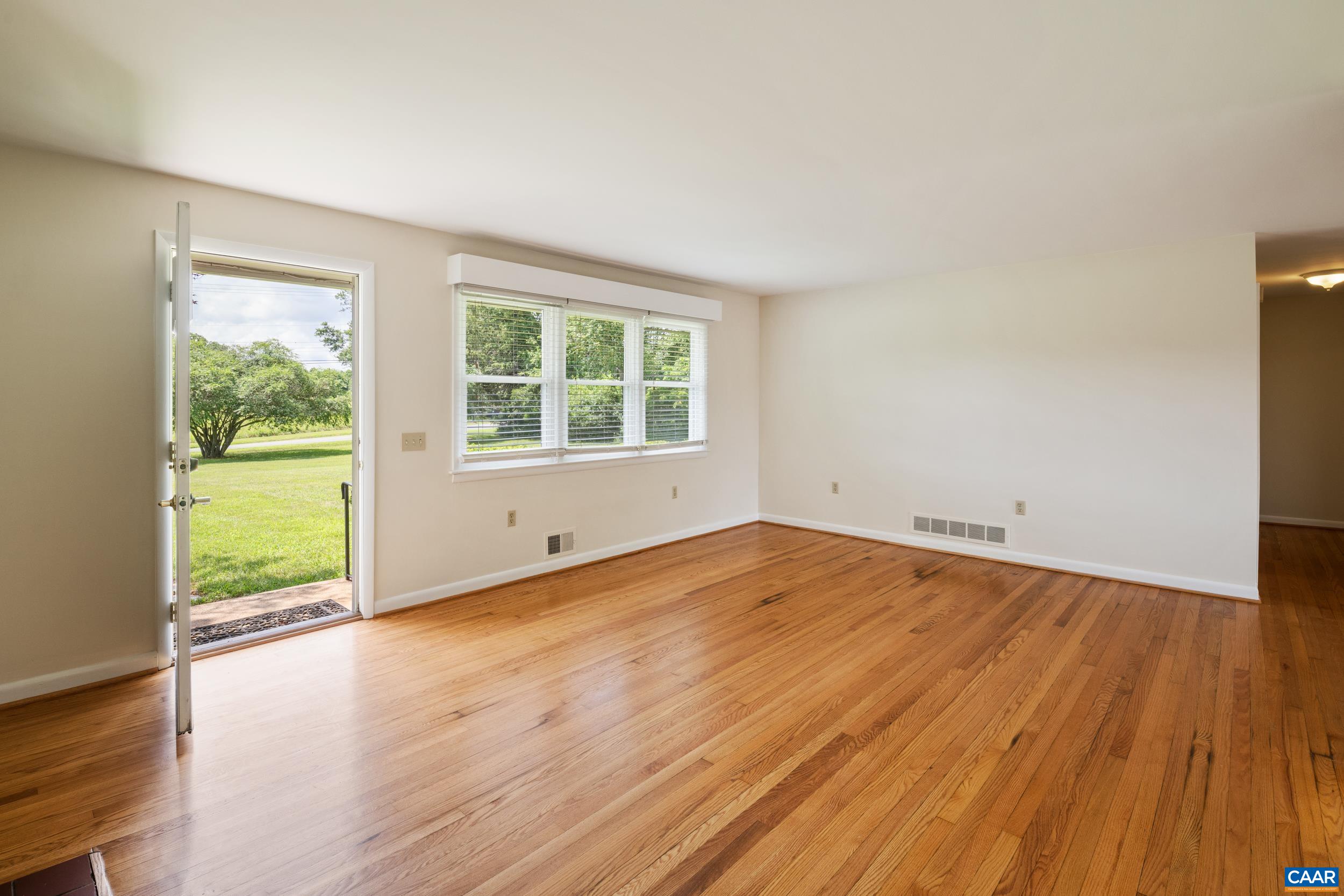 1293 Reas Ford Road Earlysville, VA 22936 - Photo 9 of 38 an empty room with wooden floor and windows