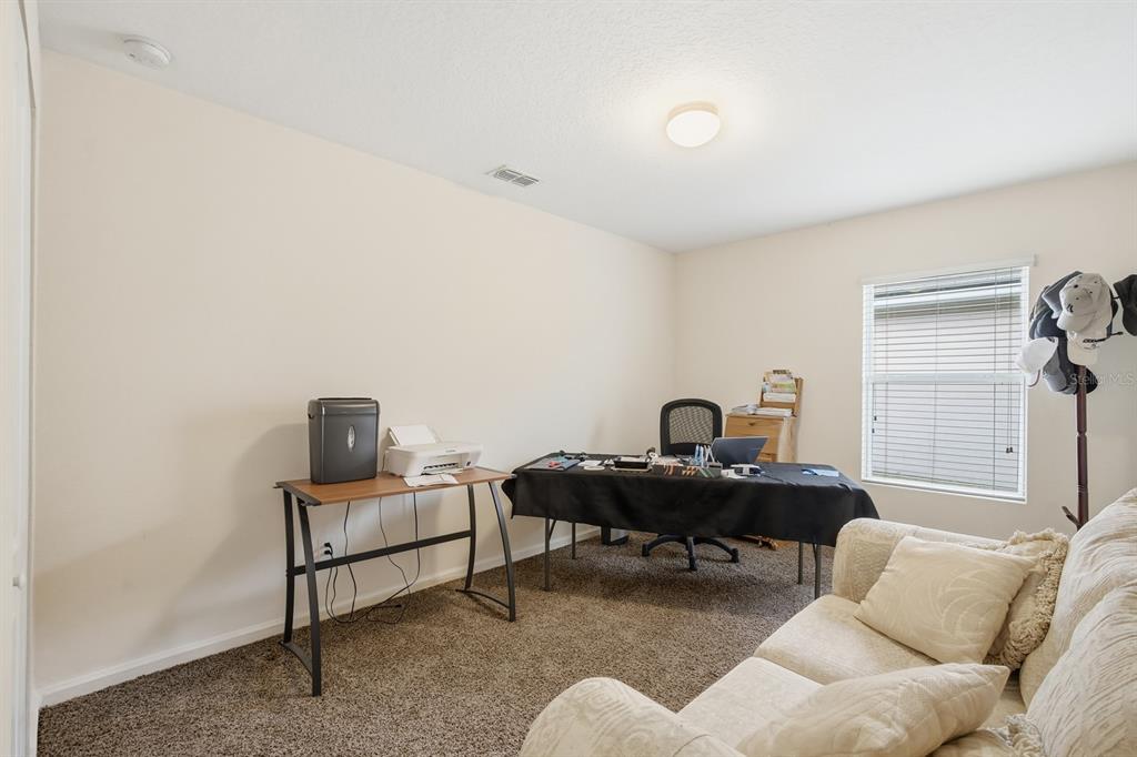 123 Fairway Court Bunnell, FL 32110 - Photo 14 of 22 a livingroom with workspace and a couch