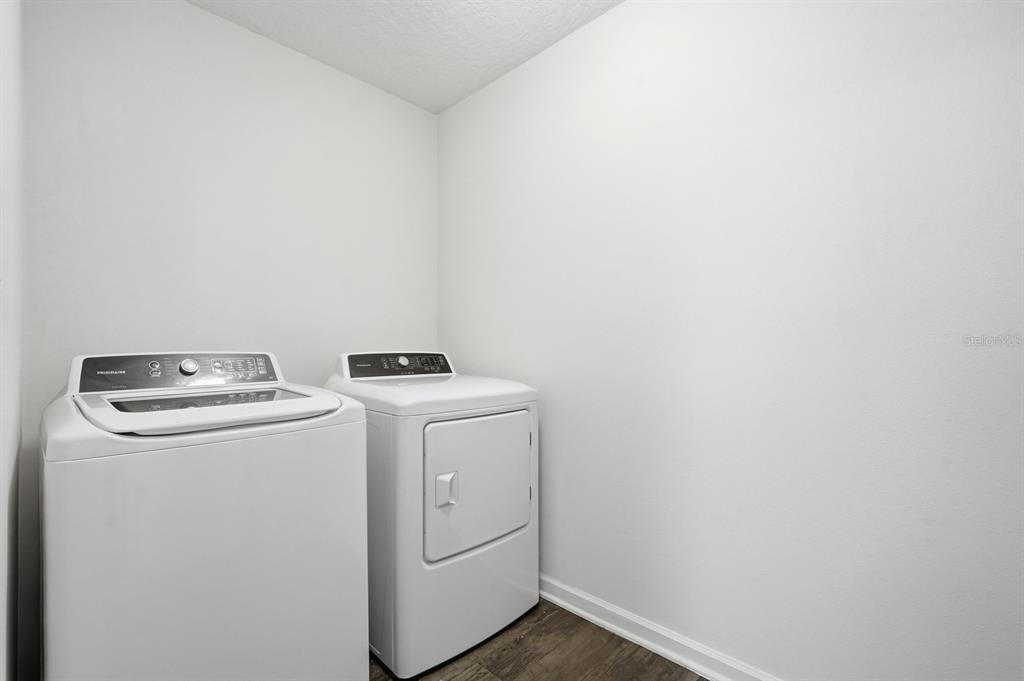 123 Fairway Court Bunnell, FL 32110 - Photo 16 of 22 a utility room with dryer and washer