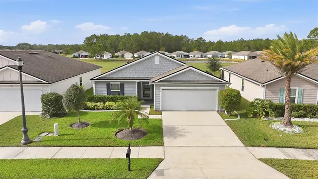 a aerial view of a house with a yard
