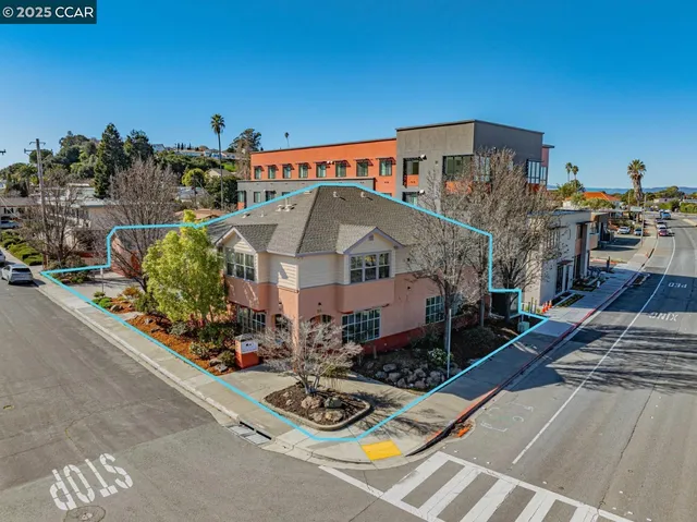 a buildings covered with tall trees