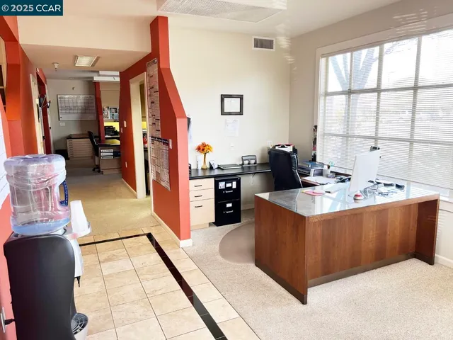 a workspace with furniture and a window