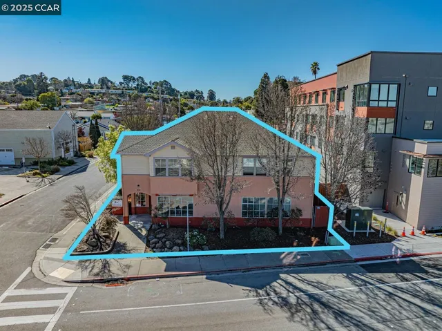 a kitchen with a table chairs sink and cabinets