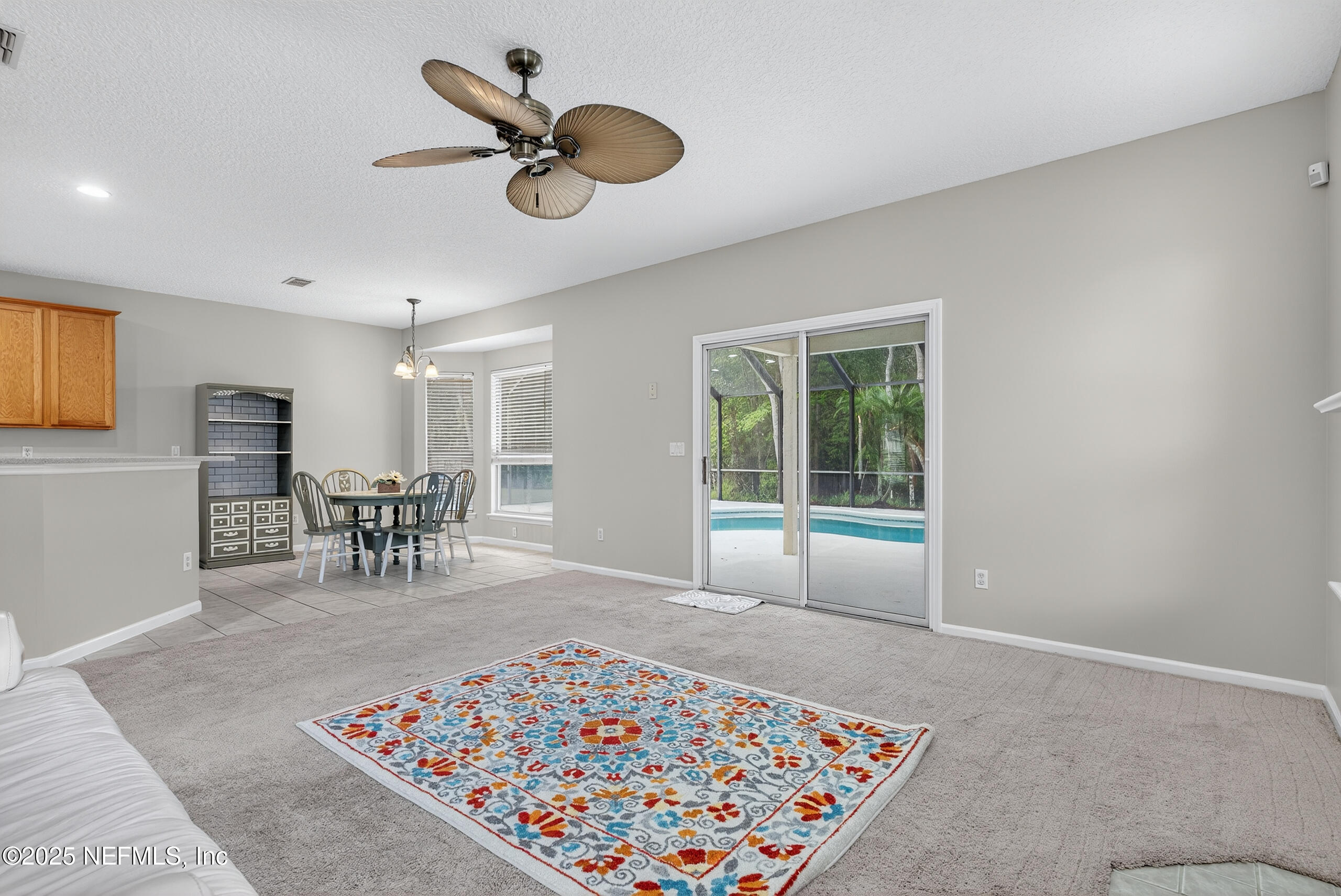1908 Tuscan Oaks Court Fleming Island, FL 32003 - Photo 17 of 33 a living room with furniture rug and window