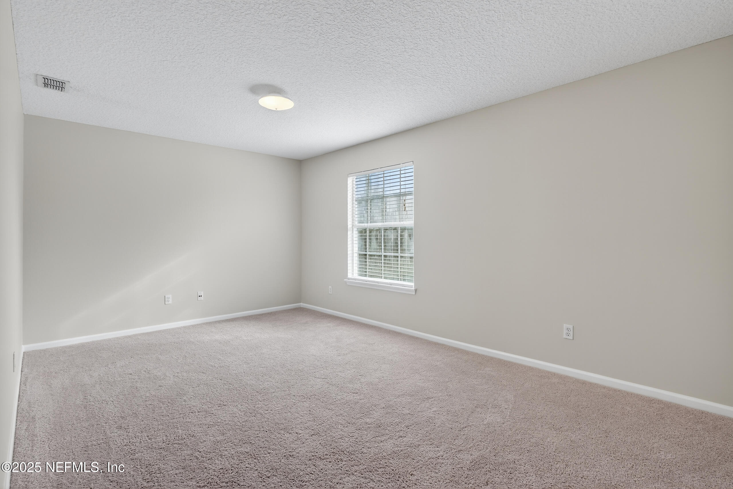 1908 Tuscan Oaks Court Fleming Island, FL 32003 - Photo 21 of 33 an empty room with a window