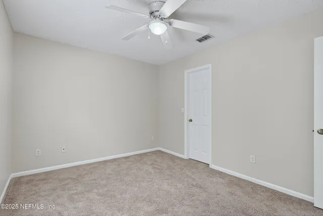 an aerial view of a house with garden space and outdoor seating