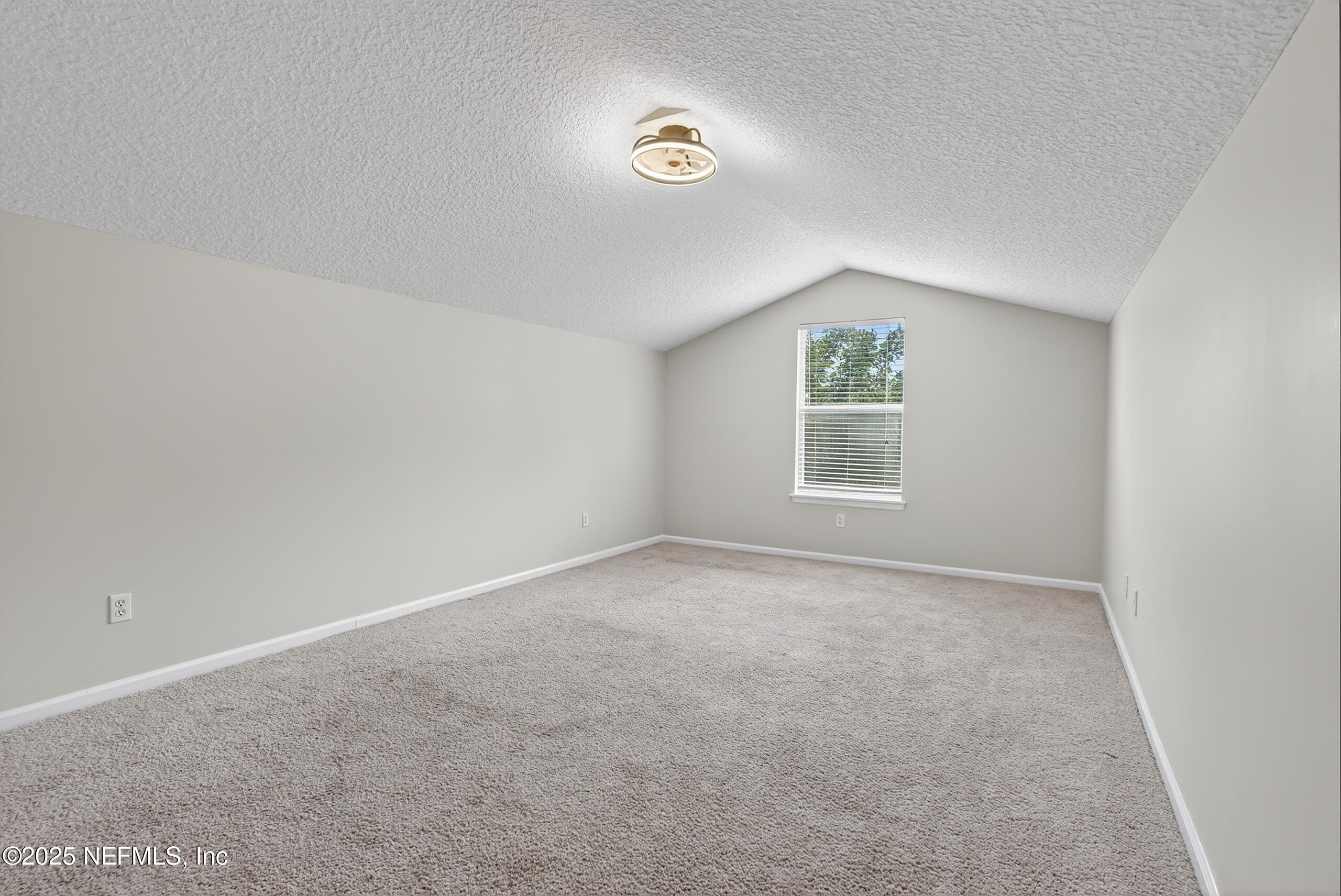1908 Tuscan Oaks Court Fleming Island, FL 32003 - Photo 30 of 33 an empty room with a window