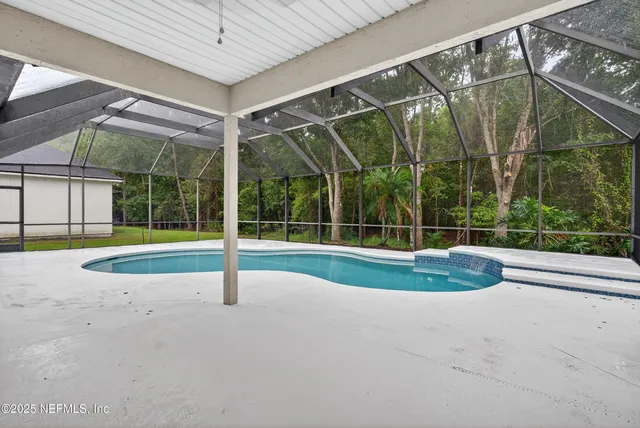 a front view of a house with a garden and plants