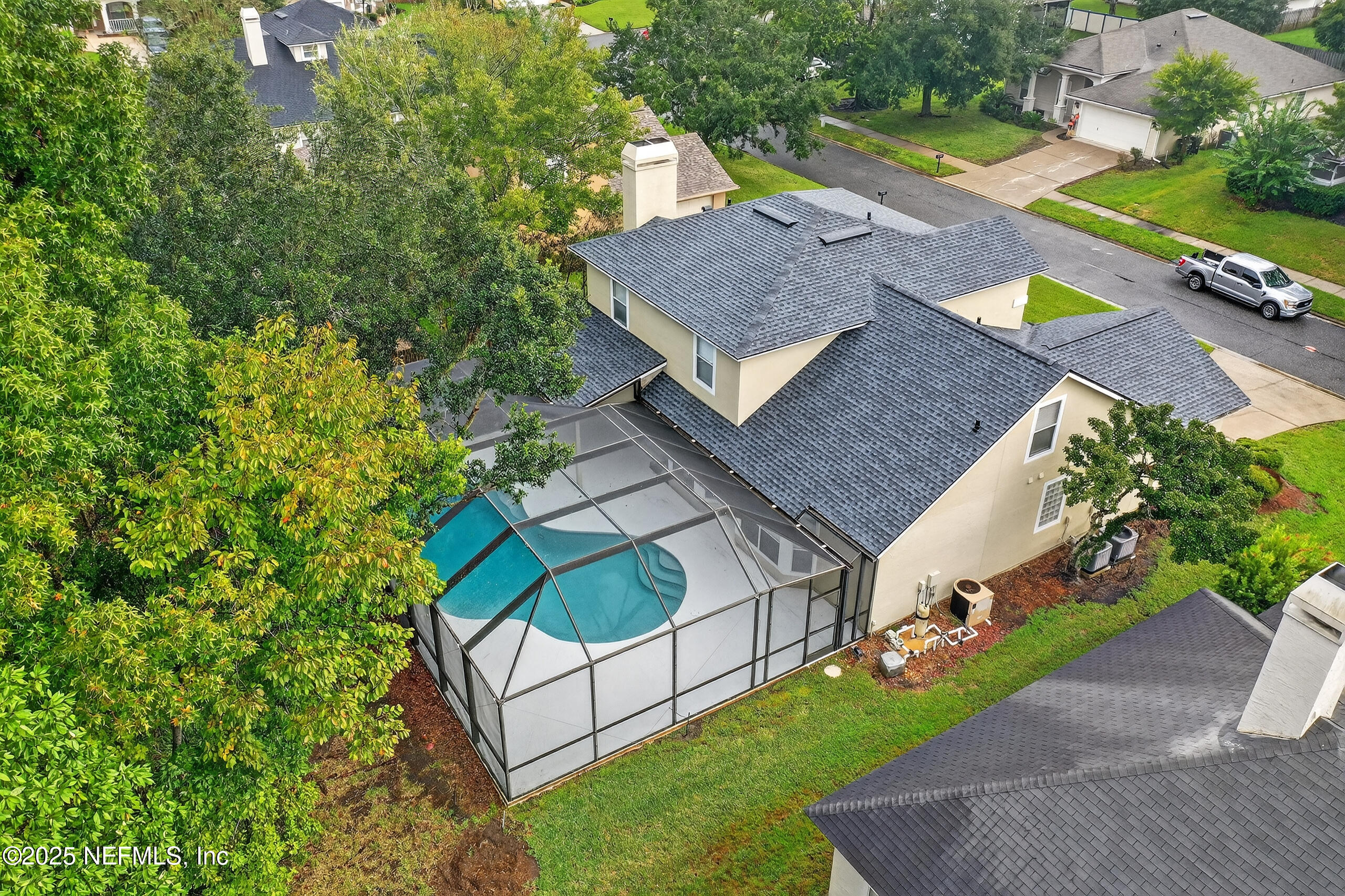 1908 Tuscan Oaks Court Fleming Island, FL 32003 - Photo 32 of 33 an aerial view of a house having swimming pool garden and patio