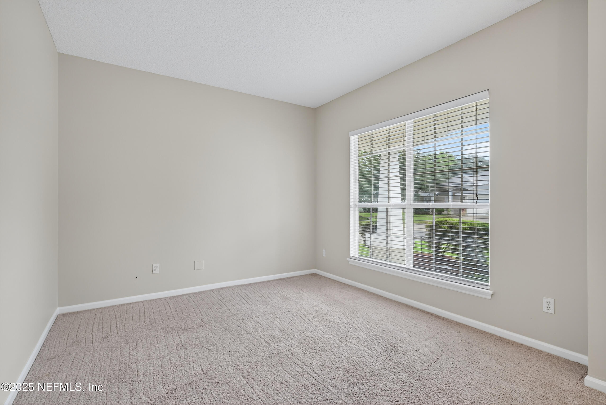 1908 Tuscan Oaks Court Fleming Island, FL 32003 - Photo 7 of 33 an empty room with a window