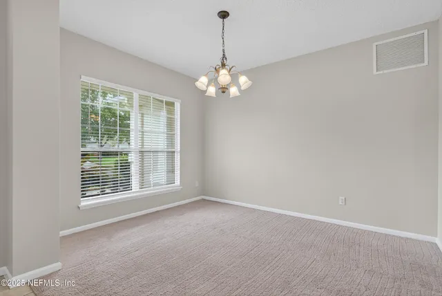 a kitchen with stainless steel appliances a sink stove and cabinets