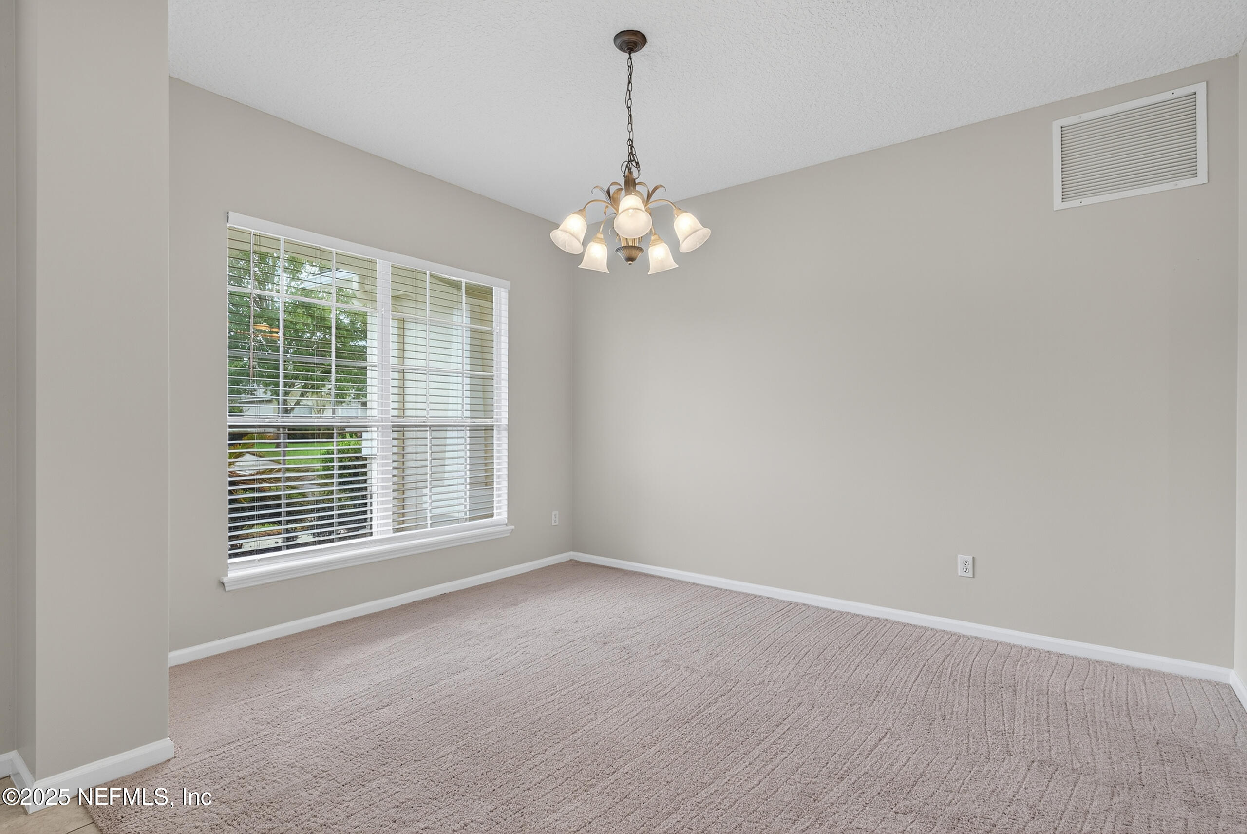 1908 Tuscan Oaks Court Fleming Island, FL 32003 - Photo 8 of 33 a view of an empty room with a window