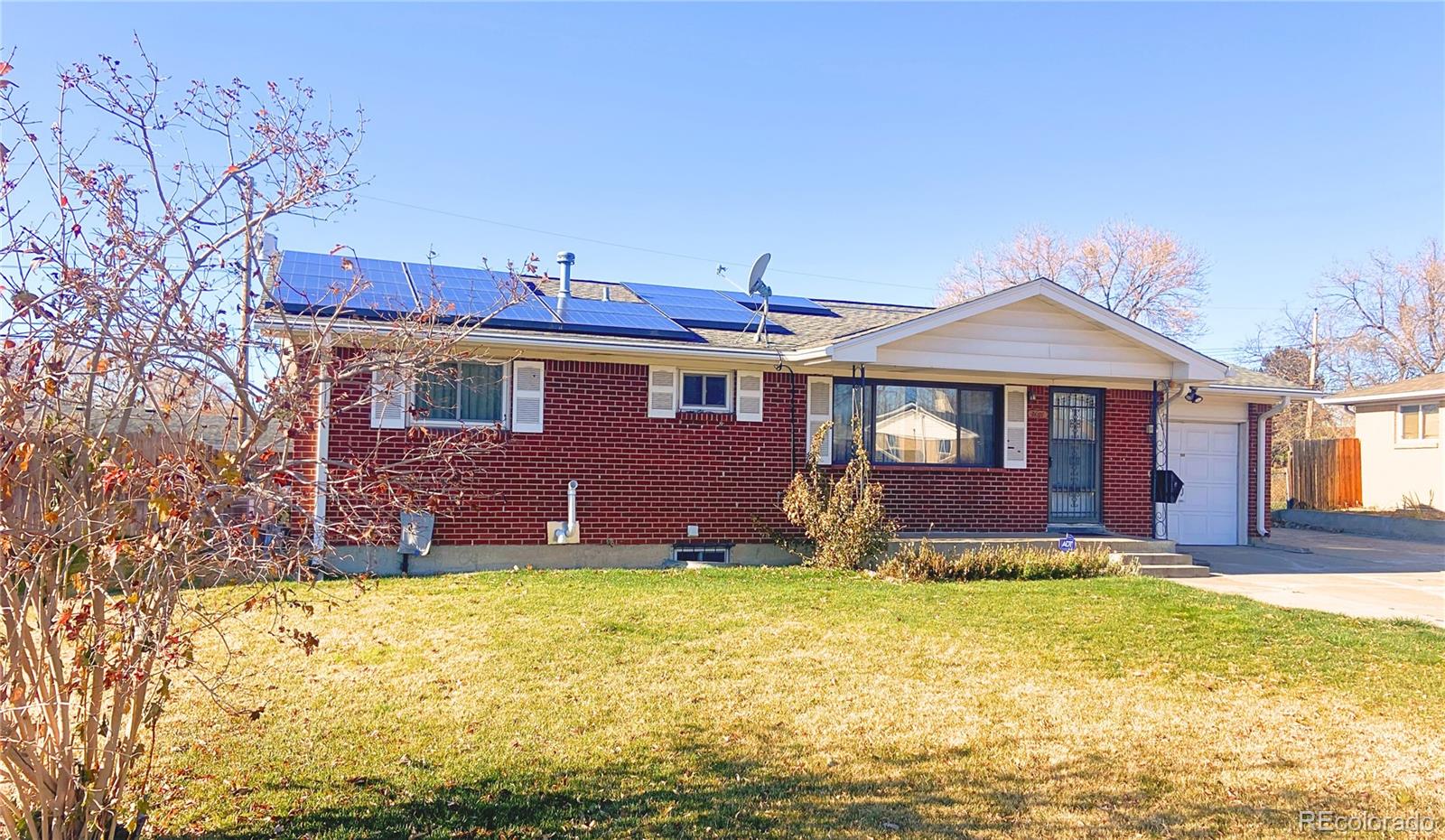 a front view of house with yard and swimming pool